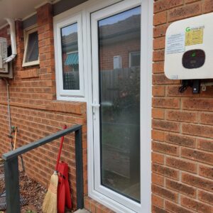 swing-door-with-Low-E-energy-efficient-glass-in-a-white-energy-sound-efficient-UPVC-frames